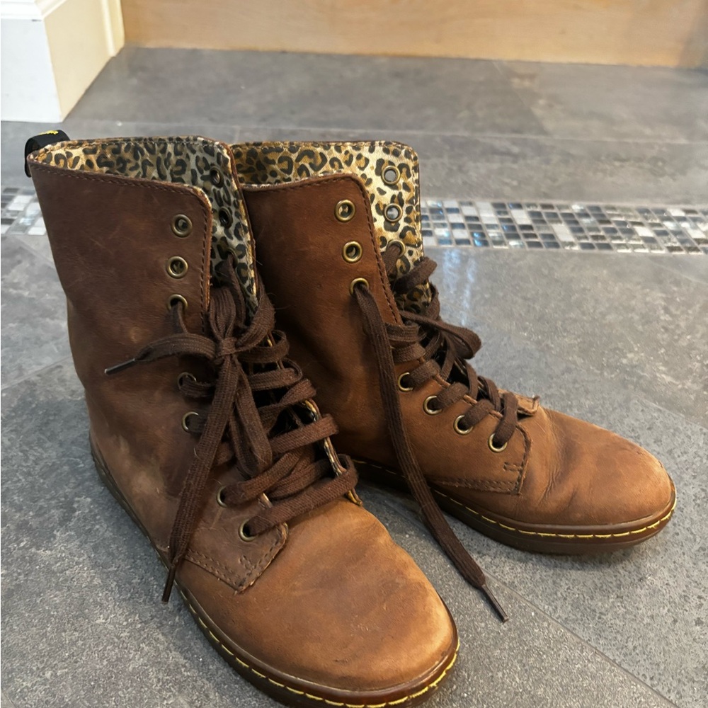 Dr Martens brown boots with leopard patterns inside